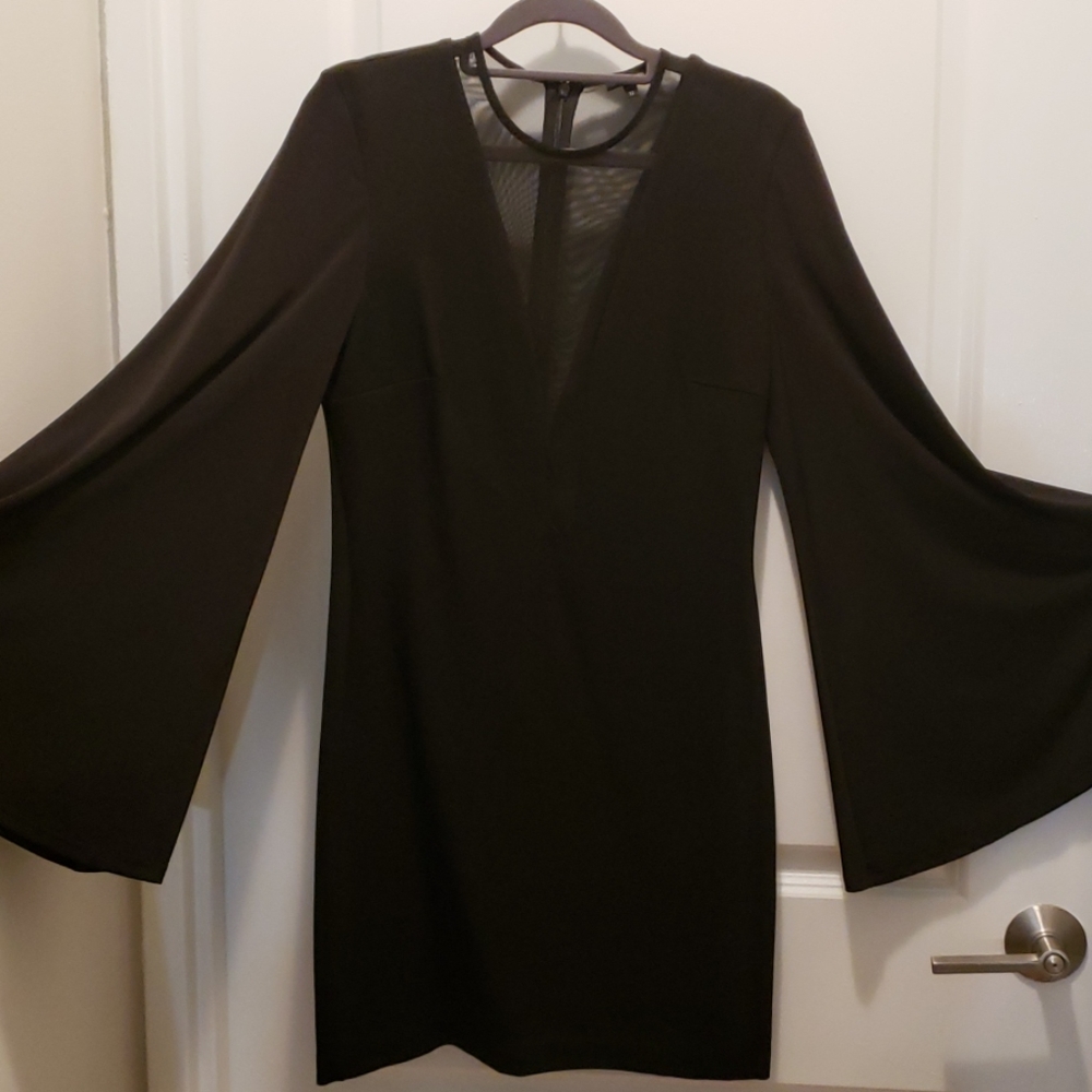 Black knee length cocktail dress with mesh panels